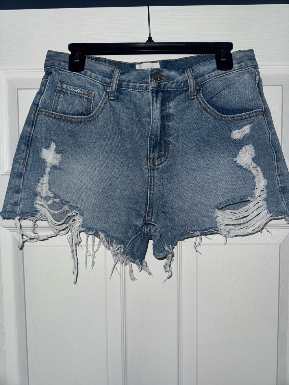 High-Waist Distressed Denim Shorts in Light Blue